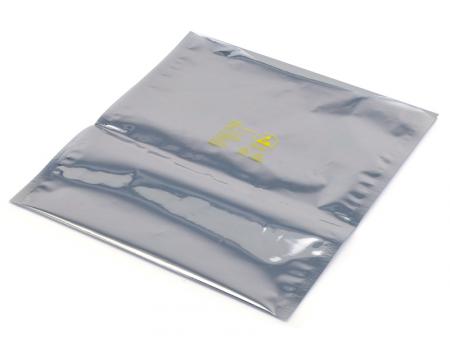 A silver bag of plastic with yellow writing.