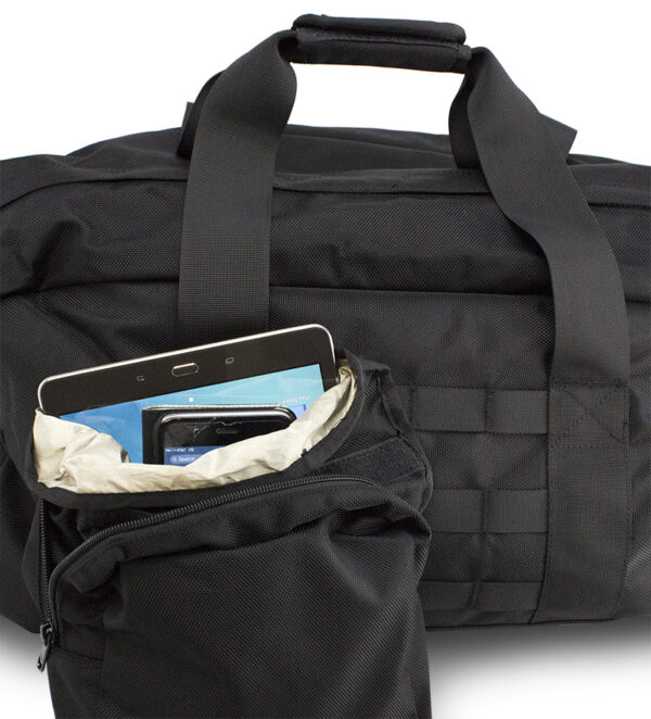 A black duffel bag with a tablet in it.