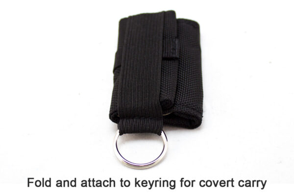 A black key case with a metal ring attached to it.